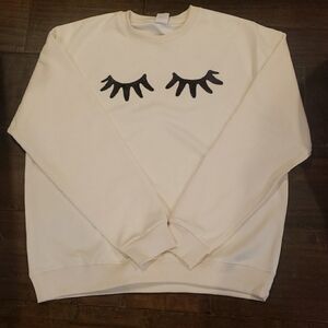 Women's Cream Sweatshirt with Eyelash Design XL.